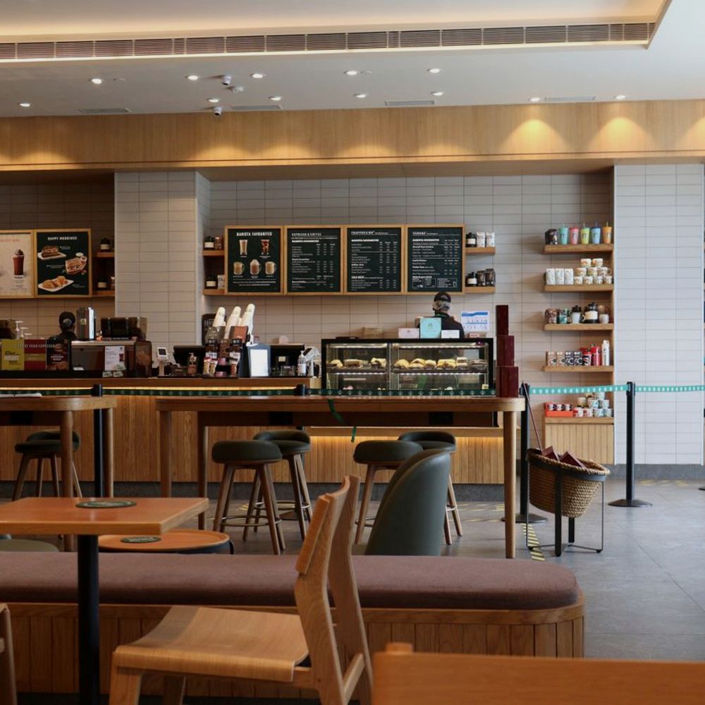 Modern cafe interior with guests - developing new hospitality brands