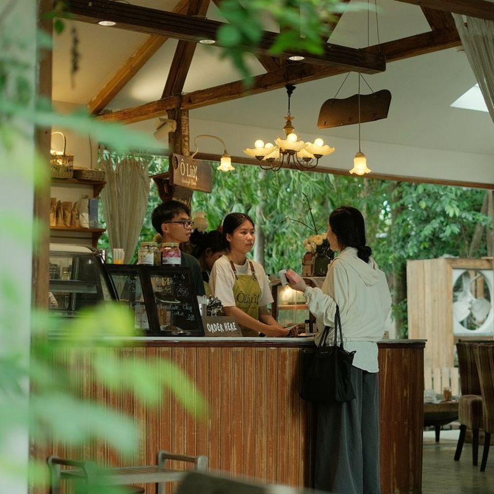 Cafe counter with staff serving guests - hospitality strategy in practice
